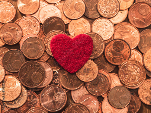 Image full of Euro cents and red heart, copper coin, one and two cents coin will be dismissed by ECB