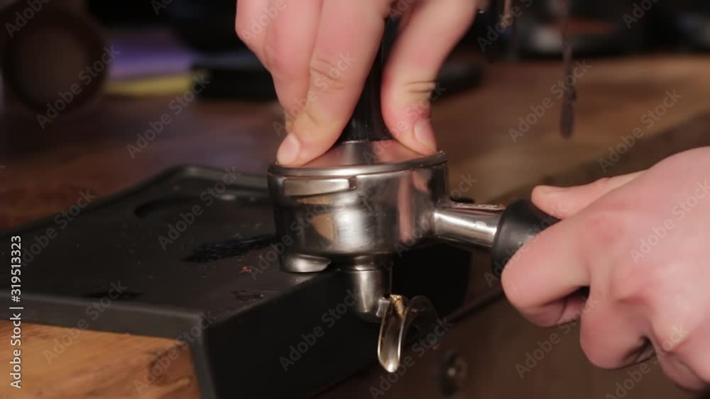Making ground coffee with tamping fresh coffee. Professional barista. Making ground coffee with tamping fresh coffee. Professional barista.