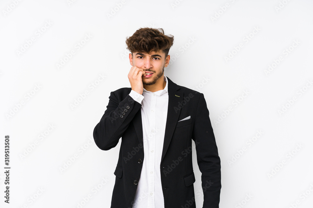 Young arabian business man isolated biting fingernails, nervous and very anxious. Young arabian business man isolated biting fingernails, nervous and very anxious.