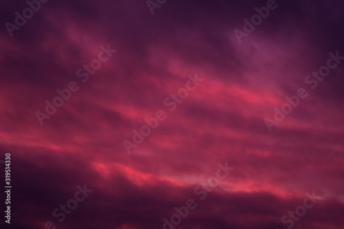 Background of sky pink red colours cloudscape, full frame nature landscape © Alex Tihonov