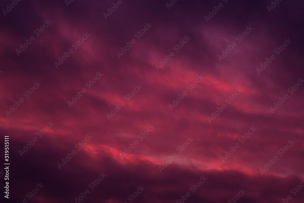 Full frame view heavy moody sky cloudscape bright pink violet colors