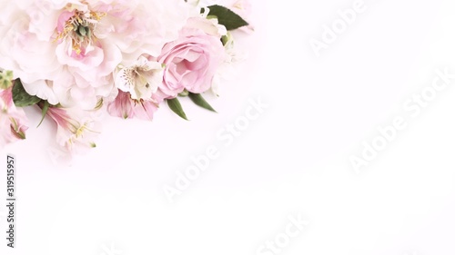 Fototapeta Naklejka Na Ścianę i Meble -  Delicate floral arrangement of light pink peonies and roses on a white background. Background for wedding cards, invitations, greetings.