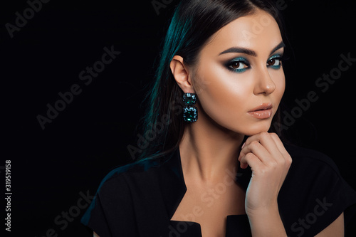 Beautiful Young Woman with Clean Fresh Skin. Perfect Makeup. Beauty Fashion. Eyelashes. Cosmetic Eyeshadow. Highlighting. Cosmetology  Beauty and Spa  Shiny eye shadow pigment.