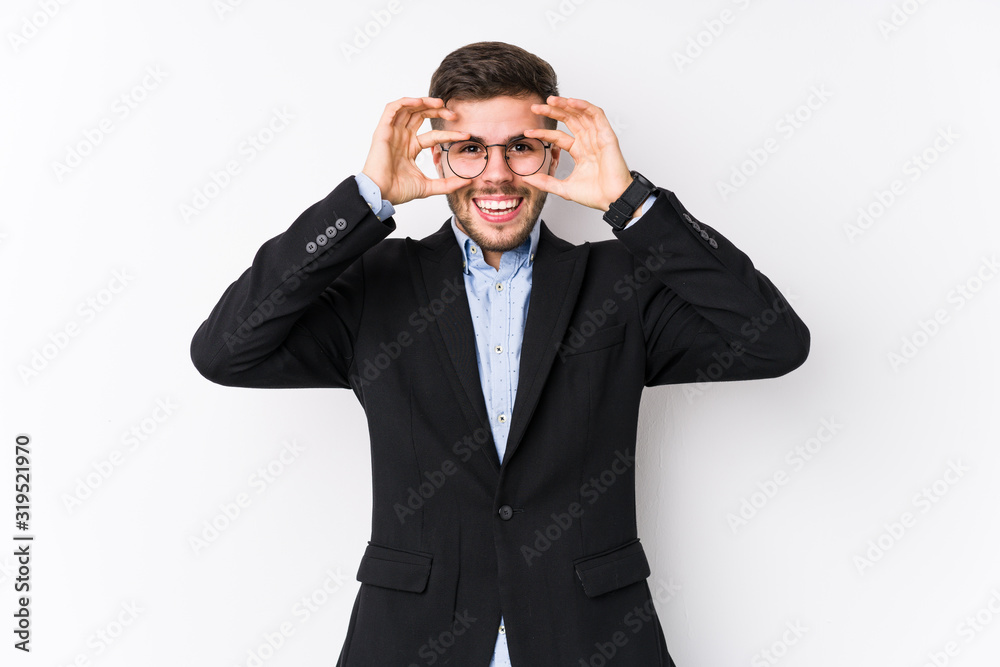 Young caucasian business man posing in a white background isolated Young caucasian business man showing okay sign over eyes Young caucasian business man posing in a white background isolated Young caucasian business man showing okay sign over eyes
