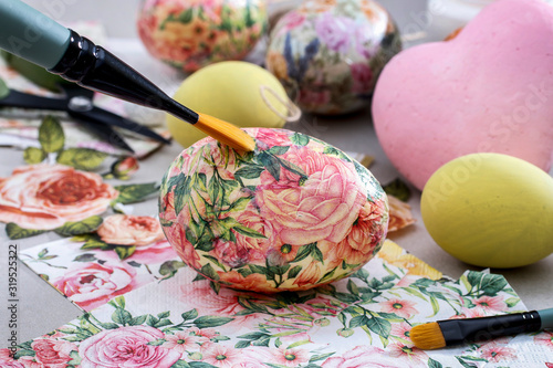 Принти на полотні Decorating Easter eggs with decoupage technique.