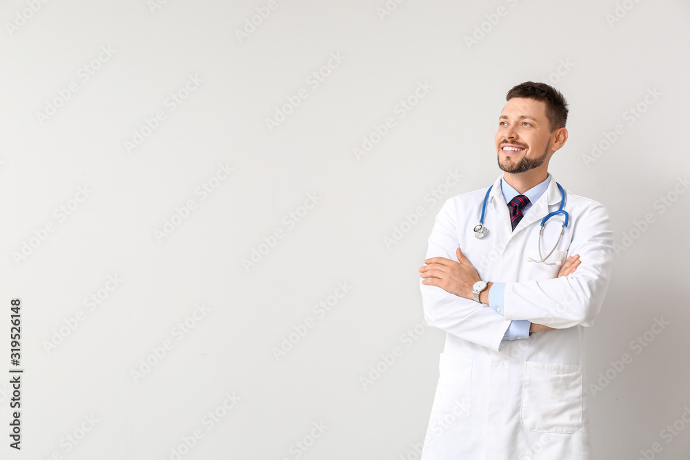 Portrait of male doctor on light background Portrait of male doctor on light background