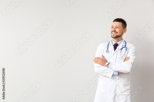 Portrait of male doctor on ...