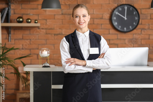Young female receptionist n...