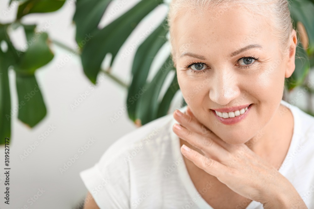 Beautiful mature woman with healthy skin at home Beautiful mature woman with healthy skin at home
