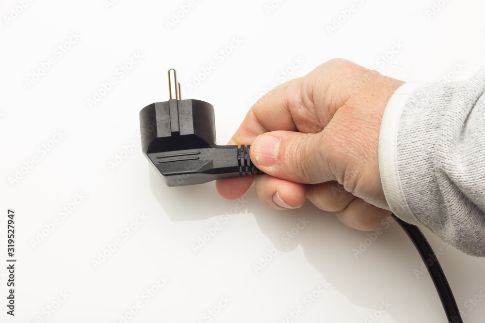 Black plug on colored background Black plug on colored background