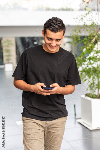 Young man walking in the mall