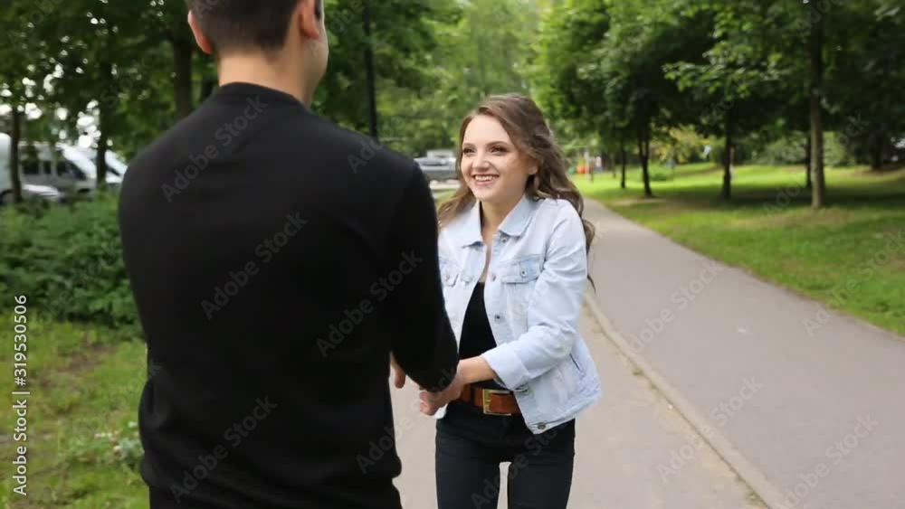 Young beautiful couple walking along the waterfront / Lifestyle Young beautiful couple walking along the waterfront / Lifestyle