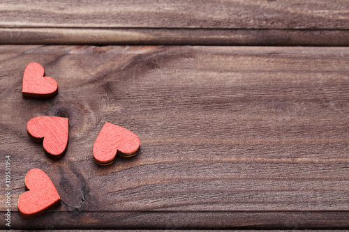 Red hearts on wooden table