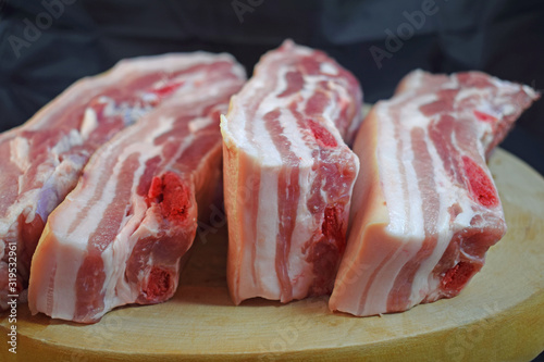 Fresh pork belly on a wooden Board.Raw meat.