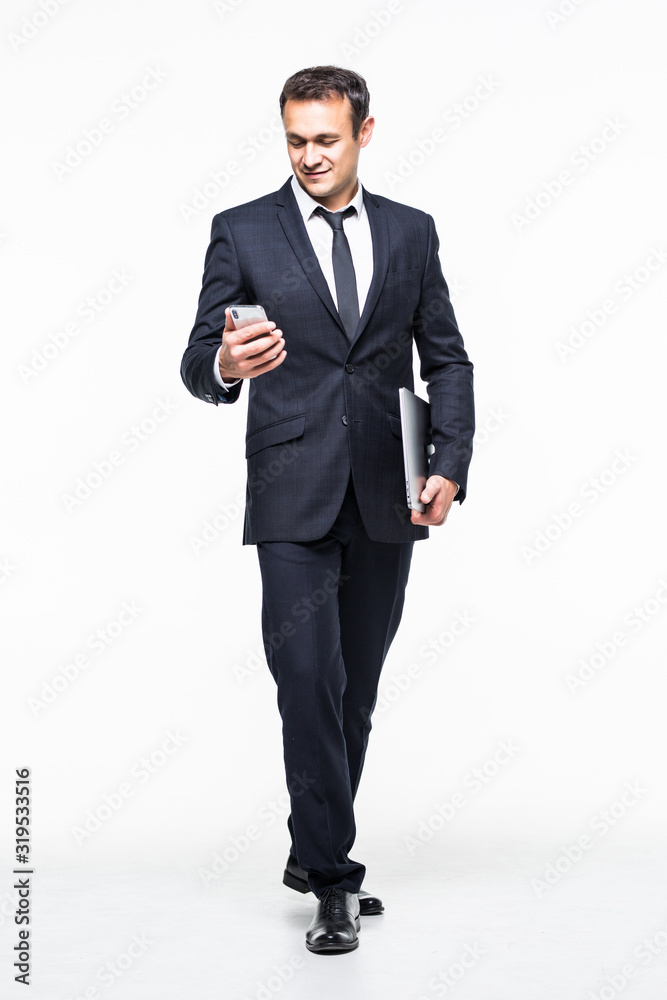 full length of successful businessman holding smart phone isolated on white background full length of successful businessman holding smart phone isolated on white background