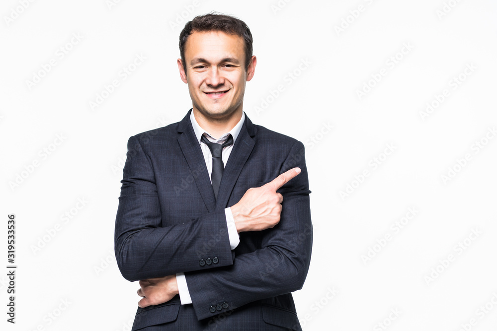Handsome young business man pointing to his right side isolated on white background Handsome young business man pointing to his right side isolated on white background