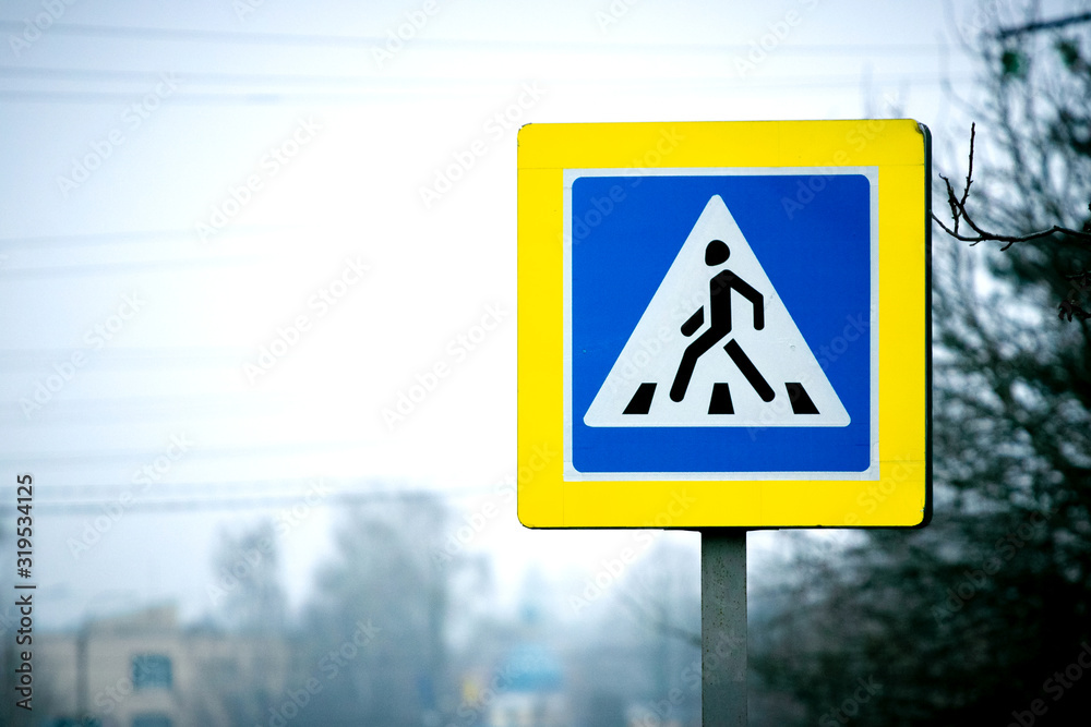 Pedestrian crossing sign on the side of the road. Road safety_ Pedestrian crossing sign on the side of the road. Road safety_