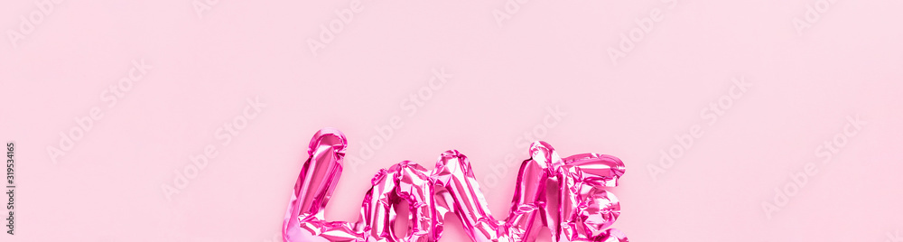 Love concept. Inflatable pink balloon with letters