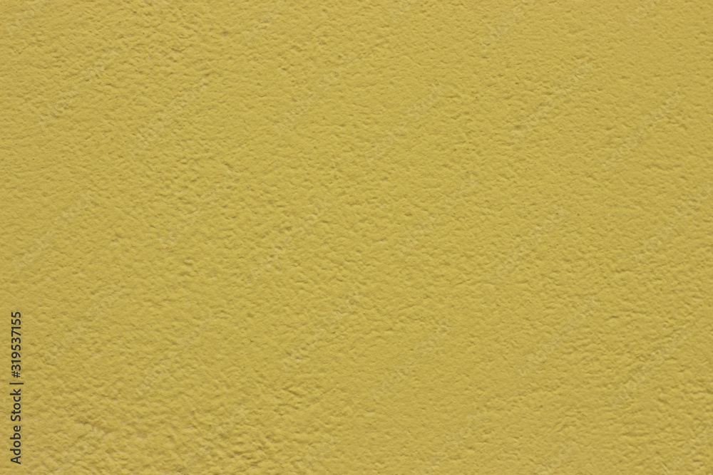 Fototapeta premium Yellow concrete wall background texture