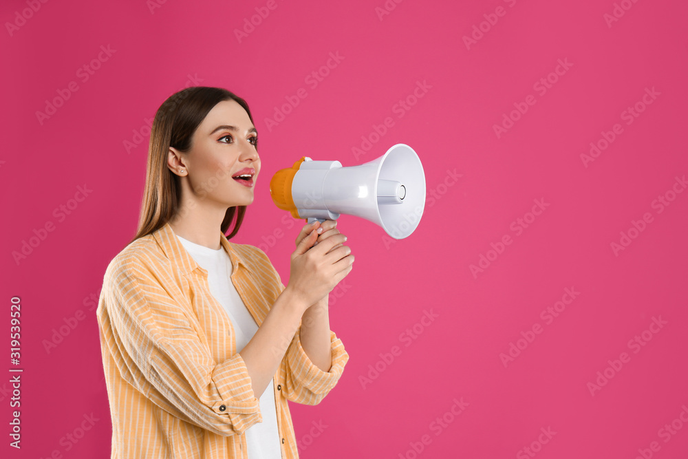Young woman with megaphone on pink background. Space for text Young woman with megaphone on pink background. Space for text