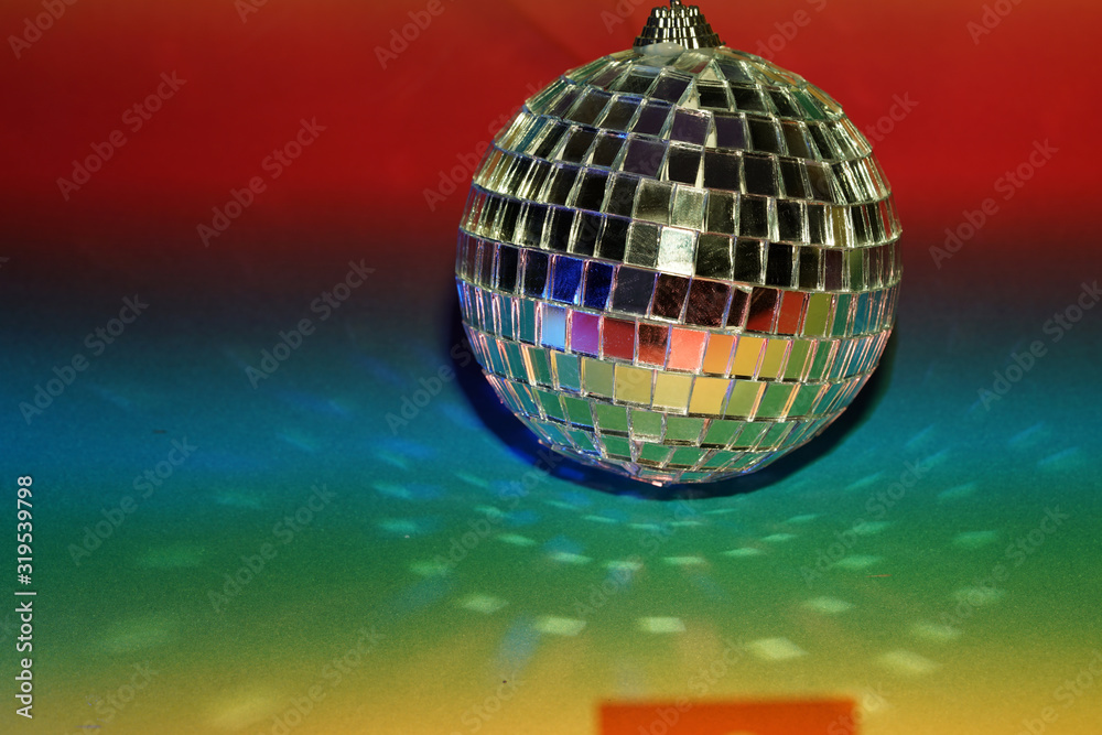 Disco ball with colored flash foils photographed in the studio
