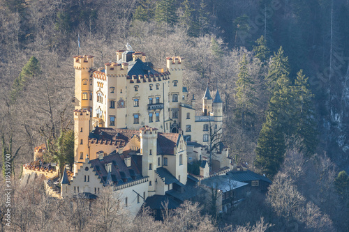 Aerial view of the Hohenschwangau Castle on a sunny day in winter from the Neuschwanstein Castle, Schwangau, Bavaria, Germany photo