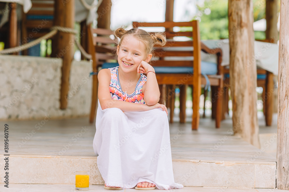 Cute little girl at beach during caribbean vacation Cute little girl at beach during caribbean vacation