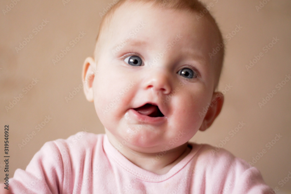 portrait of a little girl who makes faces and smiles