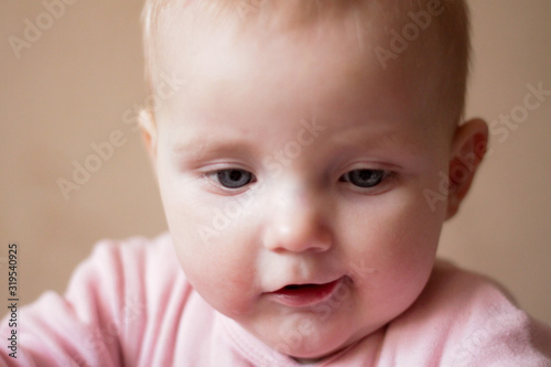 portrait of a little girl who makes faces and smiles