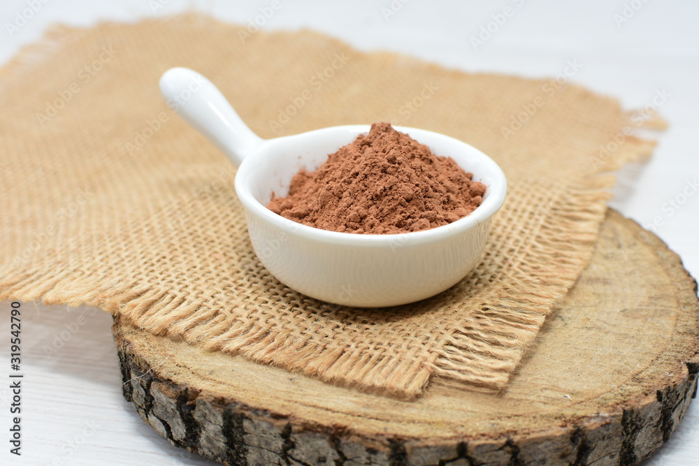 Chocolate powder on wooden background Chocolate powder on wooden background
