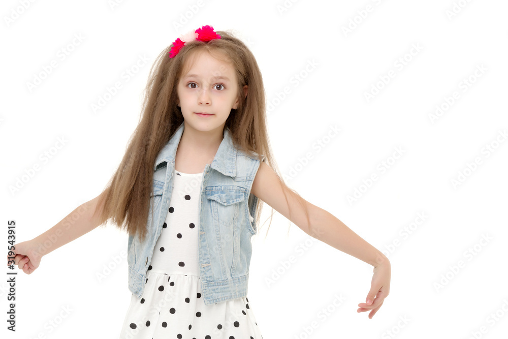 A cheerful little girl is dancing. A cheerful little girl is dancing.