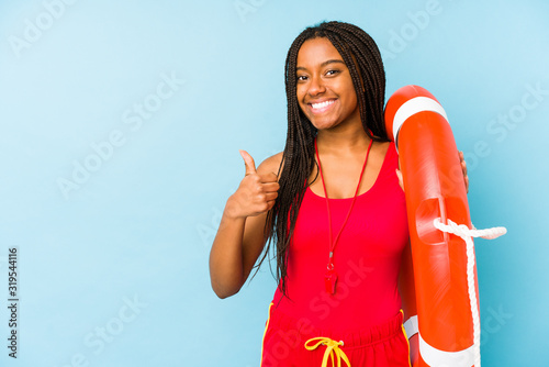 Young african american life guard woman isolated smiling and raising thumb up