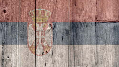 Serbia Politics News Concept: Serbian Flag Wooden Fence