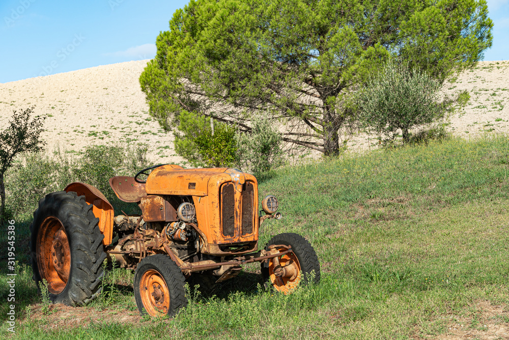 Old tractor rust in Tuscany. Countryside Italy. Old tractor rust in Tuscany. Countryside Italy.