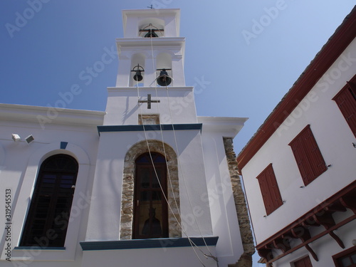 Fototapeta Naklejka Na Ścianę i Meble -  View of the Church in the old town, old streets and houses of the city of Skopelos on the island of Skopelos, Greece.