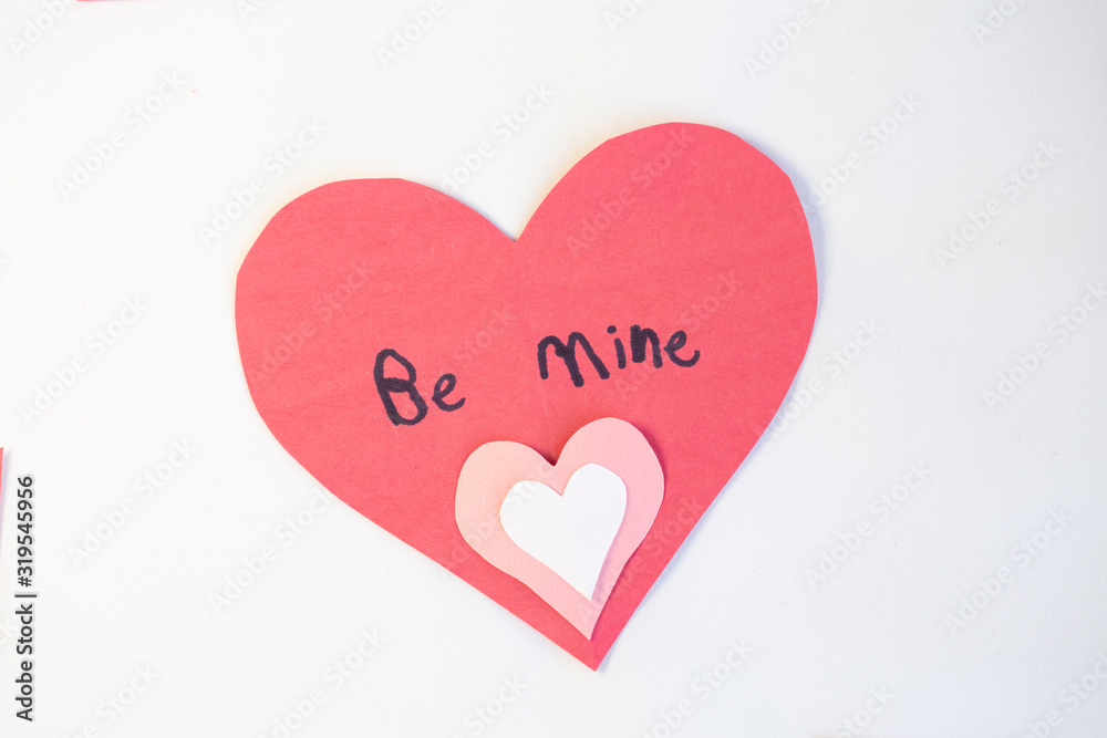 construction paper valentine cards with 'Be Mine' written in child's writing
