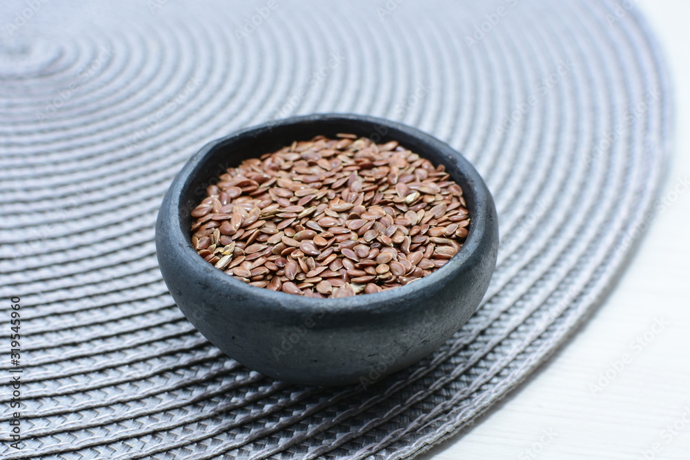 natural flaxseed seeds displayed in containers