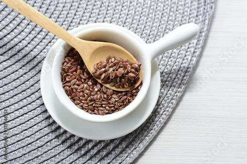  natural flaxseed seeds displayed in containers