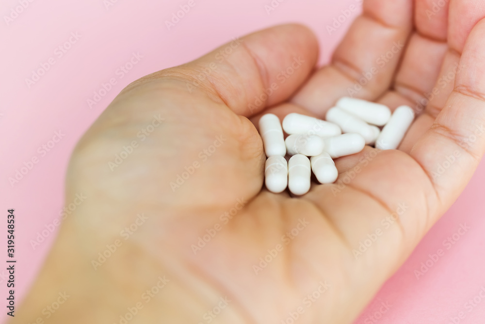 Capsules of medicine in hand. A handful of capsules close-up. Medical background Capsules of medicine in hand. A handful of capsules close-up. Medical background