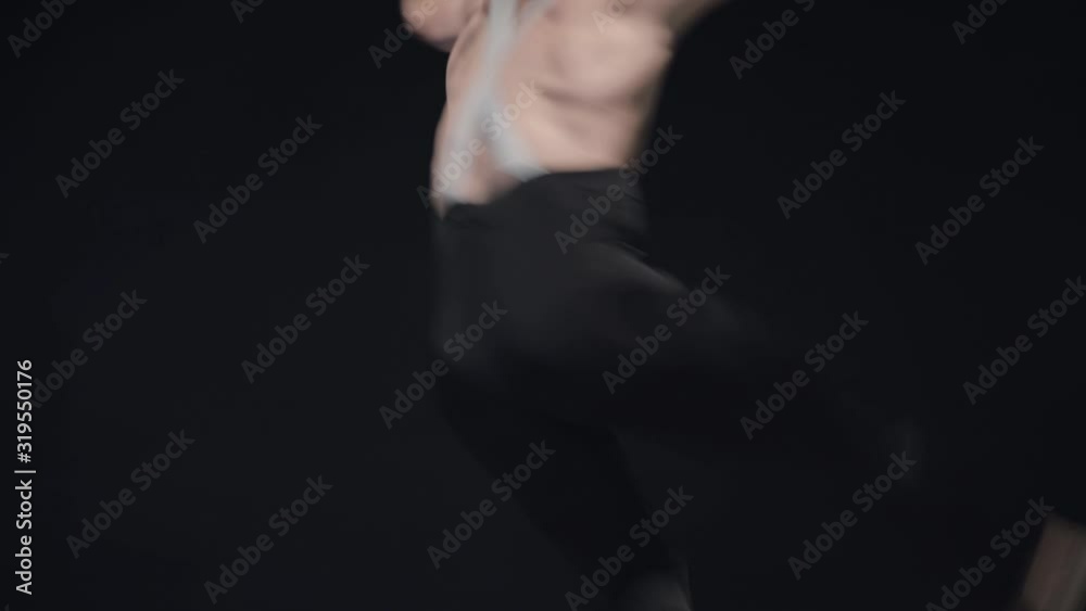 Camera following young Caucasian man spinning and jumping up. Male ballet dancer dancing on stage. Art, elegance, strength, choreography. Slowmo. Camera following young Caucasian man spinning and jumping up. Male ballet dancer dancing on stage. Art, elegance, strength, choreography. Slowmo.