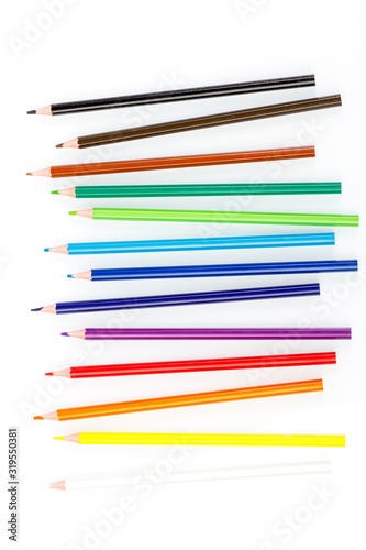 macro multicolored pencils on a white background
