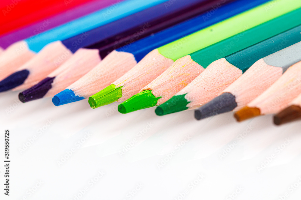 macro multicolored pencils on a white background macro multicolored pencils on a white background