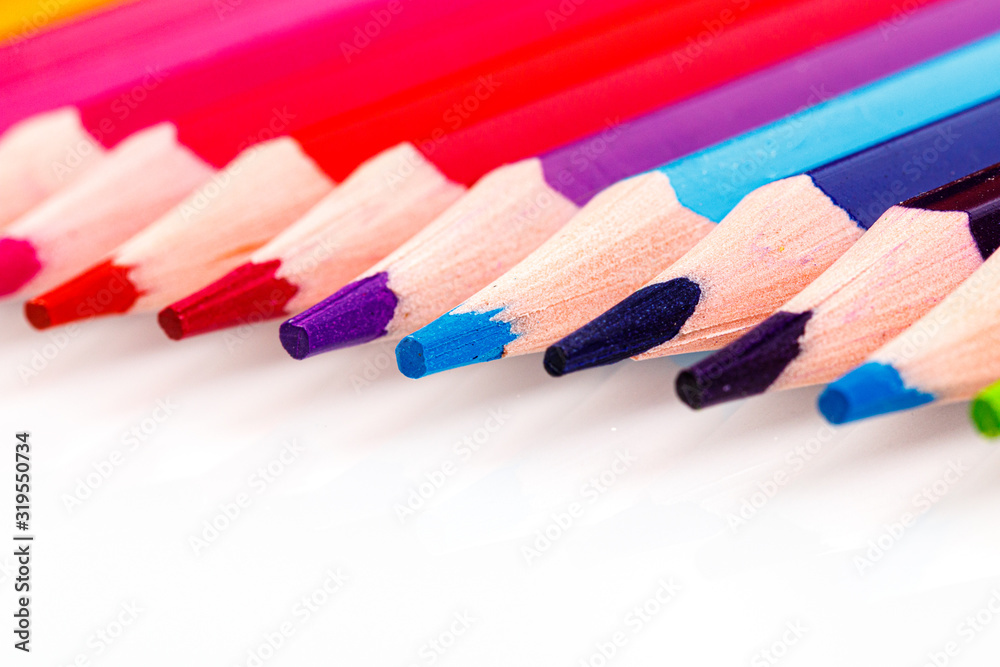 macro multicolored pencils on a white background macro multicolored pencils on a white background