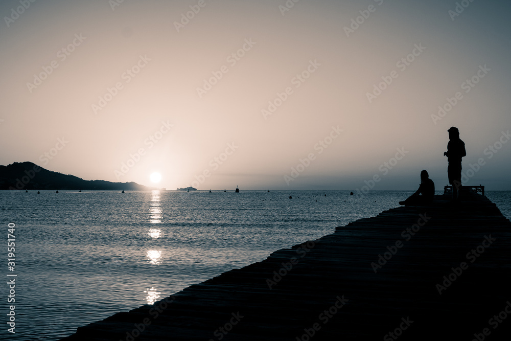 silhouette of a person on the sea silhouette of a person on the sea