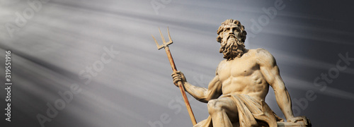 Fotografie, Obraz The mighty god of sea and oceans Neptune (Poseidon) against blue sky background
