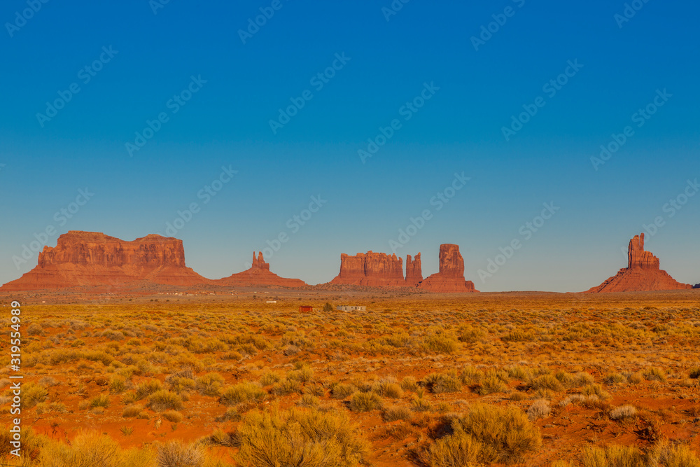 Panoramic pictures of rock formations in the evening sun in the Monument Valley National Park in winter
