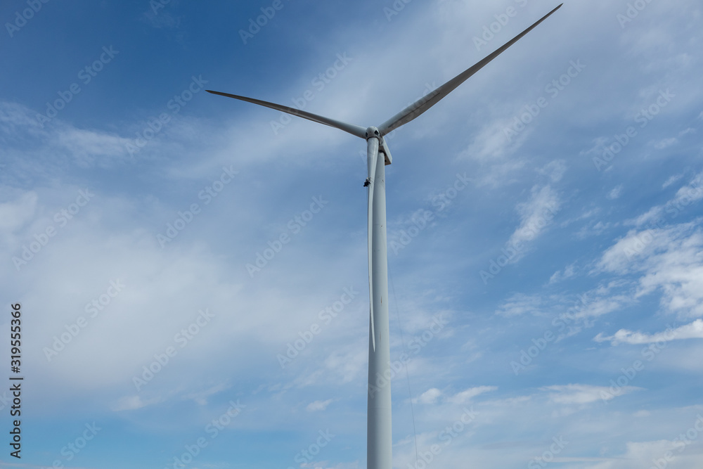 Rope access technicians working on a wind turbine blade Rope access technicians working on a wind turbine blade