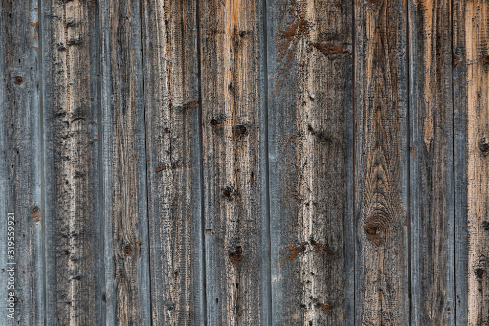Texture of darkened boards. Old wooden fence.