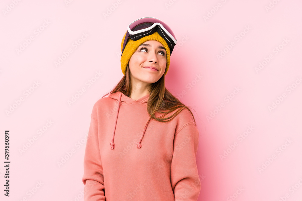 Young caucasian woman wearing a ski clothes isolated dreaming of achieving goals and purposes Young caucasian woman wearing a ski clothes isolated dreaming of achieving goals and purposes