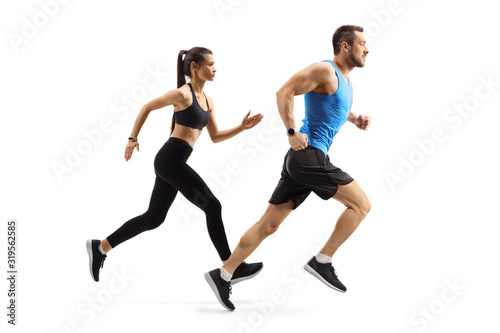 Fit man and woman in sportswear running © Ljupco Smokovski